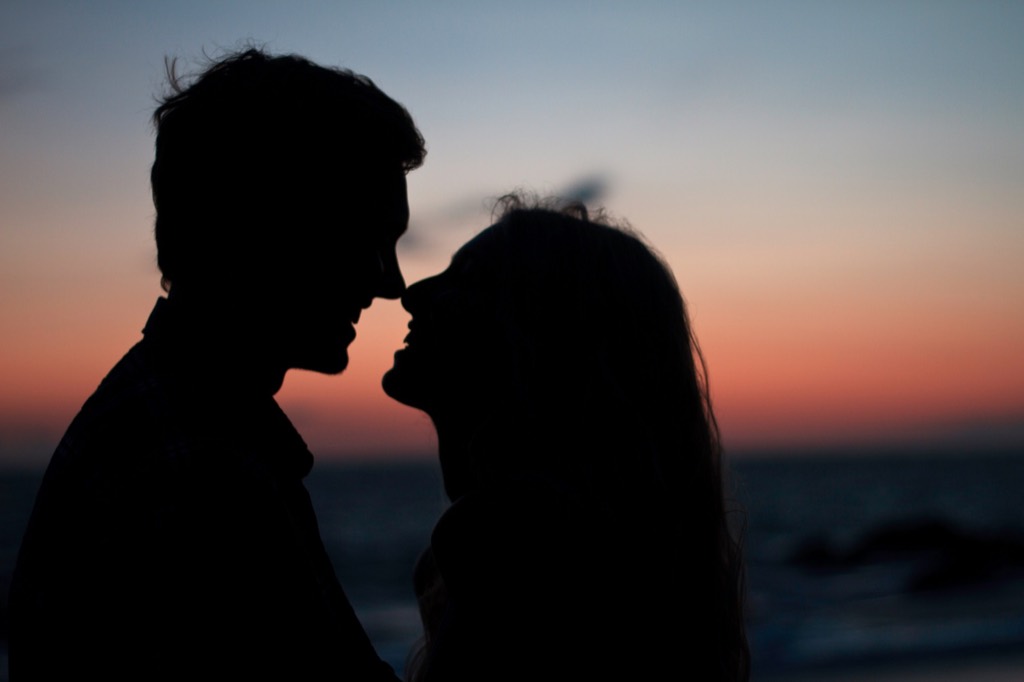 Two silhouettes at sunset.